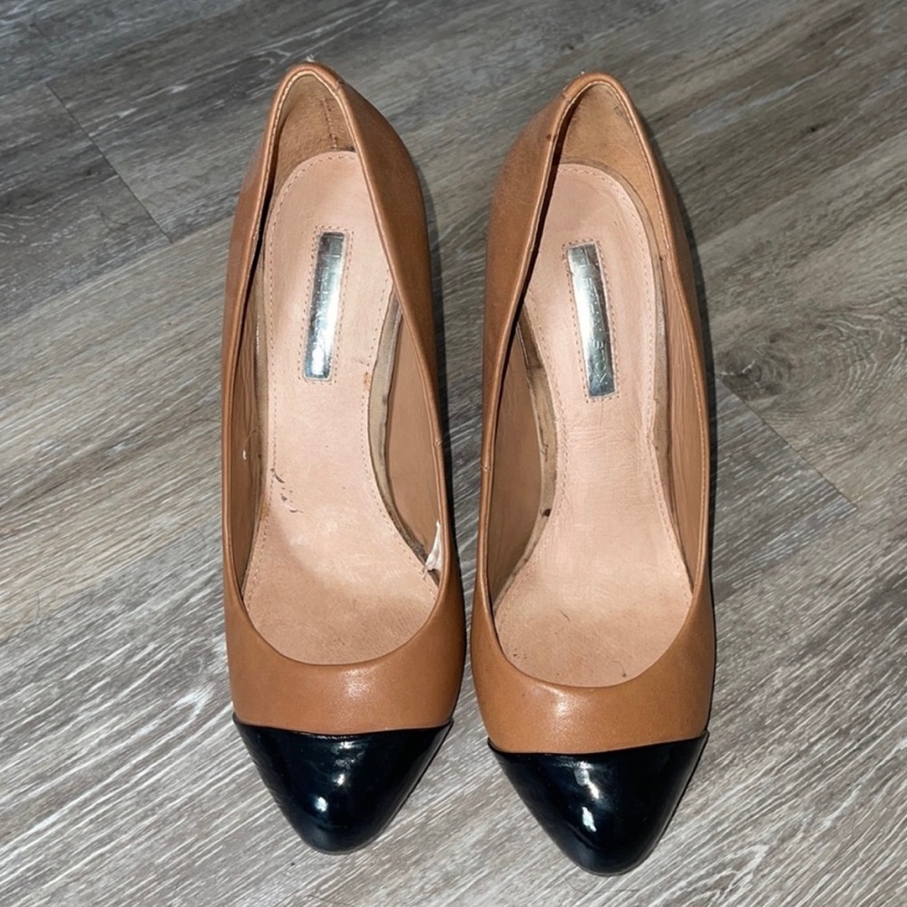 Brown and black pumps